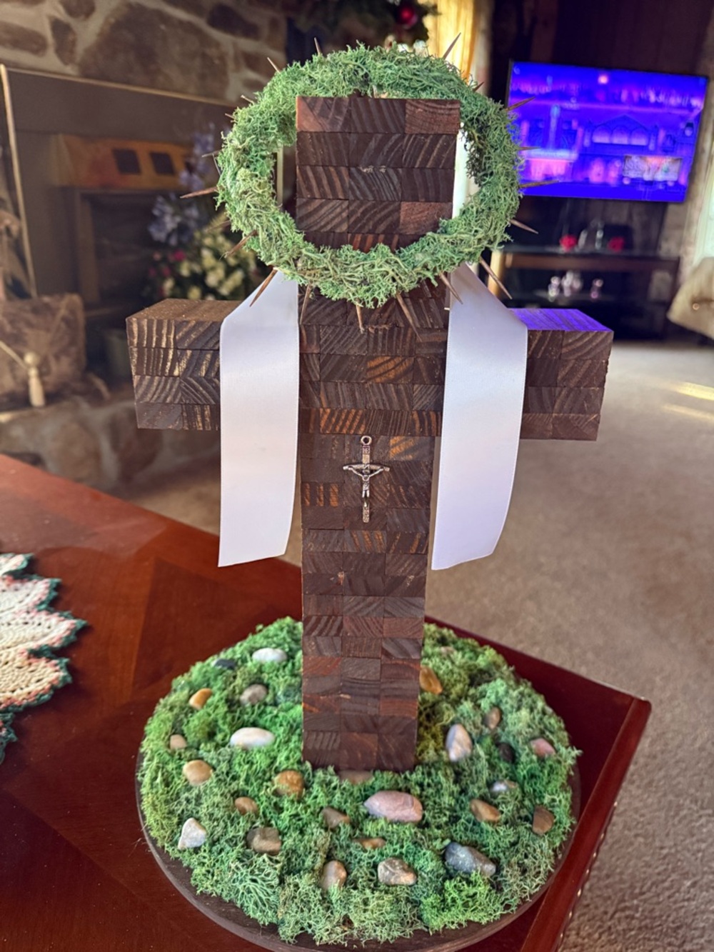 Handcrafted Wooden Cross with Green Moss Base and White Ribbon